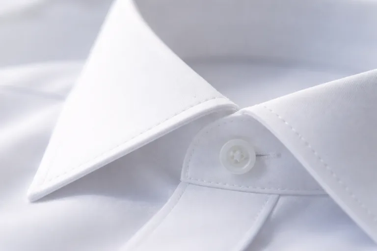 Macro shot of a shirt collar point with perfect stitching and sharp edge