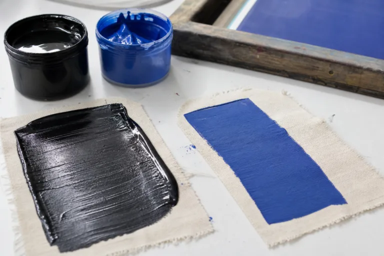 A realistic comparison scene showing how different screen printing inks behave on garment fabrics.